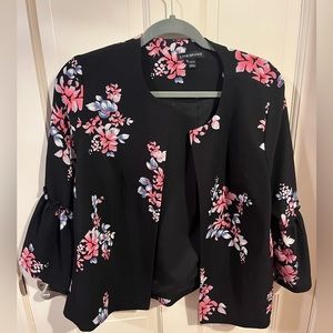 Black floral suit jacket with bell sleeves.